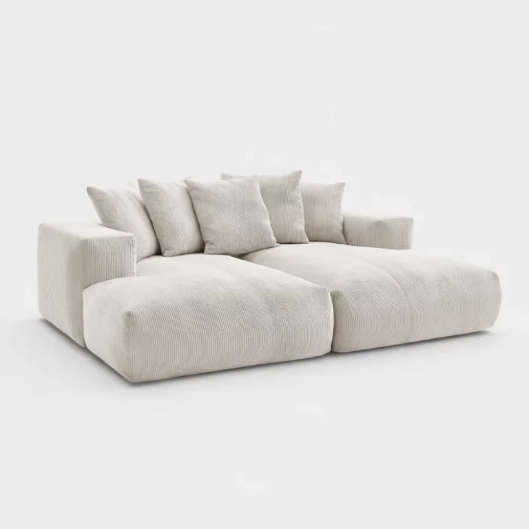 Canapé Voltaire Bobochic en tissu beige côtelé, forme modulable, accoudoirs épais, coussins assortis, vue trois quarts.