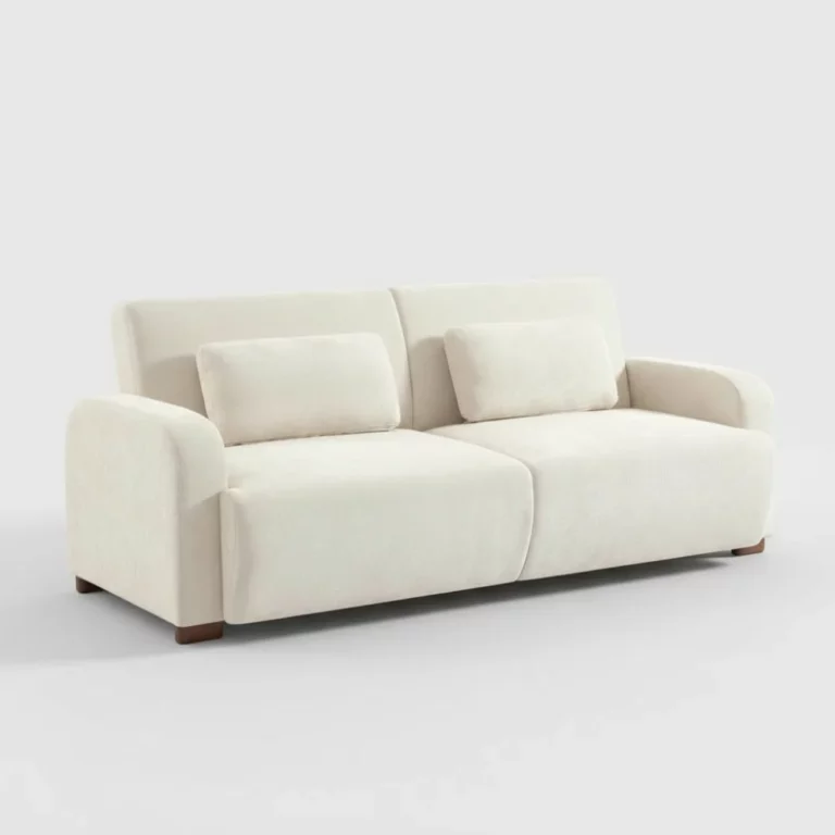 Canapé Dany Maisons du Monde en tissu beige, silhouette droite, accoudoirs arrondis, coussins assortis, pieds en bois, vue trois-quarts.