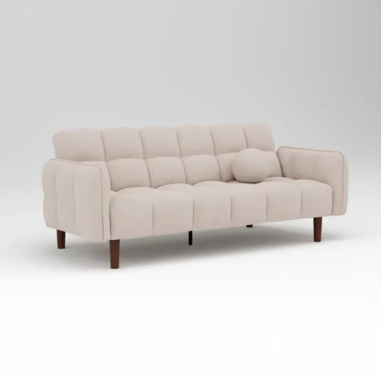 Canapé Adam Maisons du Monde en tissu beige capitonné, silhouette droite, accoudoirs arrondis, pieds en bois foncé, coussin décoratif rond inclus.