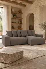 Vue d'ensemble du canapé Voltaire Bobochic d'angle convertible en velours, coloris taupe, style contemporain, dans un salon (mise en situation illustrée par IA)