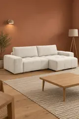 Vue d'ensemble du canapé Anakin Bobochic d'angle convertible en bouclette, coloris blanc, style contemporain, dans un séjour au mur terracotta (mise en situation illustrée par IA)