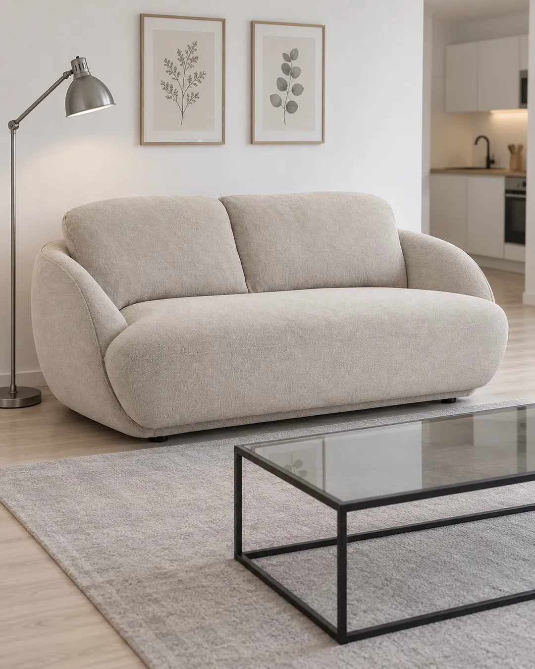 Plan rapproché du canapé Alpine La Redoute 2 places en tissu, coloris crème, style arrondi, dans un studio de 25 m² (mise en situation illustrée par IA)