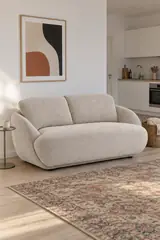 Vue d'ensemble du canapé Alpine La Redoute 2 places en tissu, coloris crème, style arrondi, dans un studio de 25 m² (mise en situation illustrée par IA)