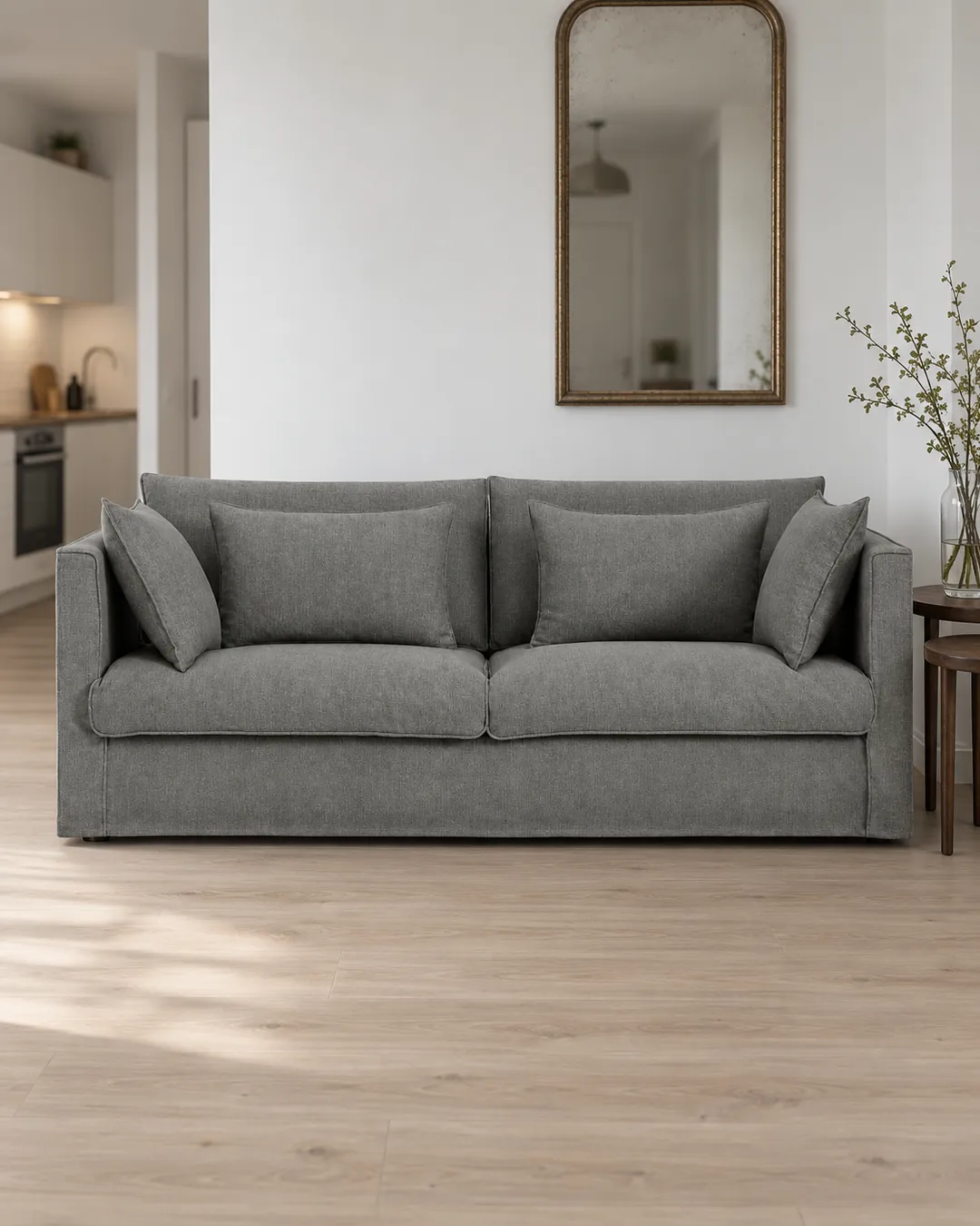 Plan rapproché du canapé Camille La Redoute 3 places en tissu, coloris anthracite, style campagne chic, dans un studio de 25 m² (mise en situation illustrée par IA)