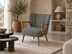 Fauteuil Meyer Maisons du Monde, fauteuil, tissu, coloris noir et blanc (motifs graphiques), mise en situation dans un salon (illustration IA 1)