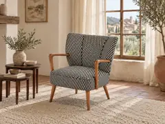 Fauteuil Meyer Maisons du Monde, fauteuil, tissu, coloris noir et blanc (motifs graphiques), mise en situation dans un salon (illustration IA 7)